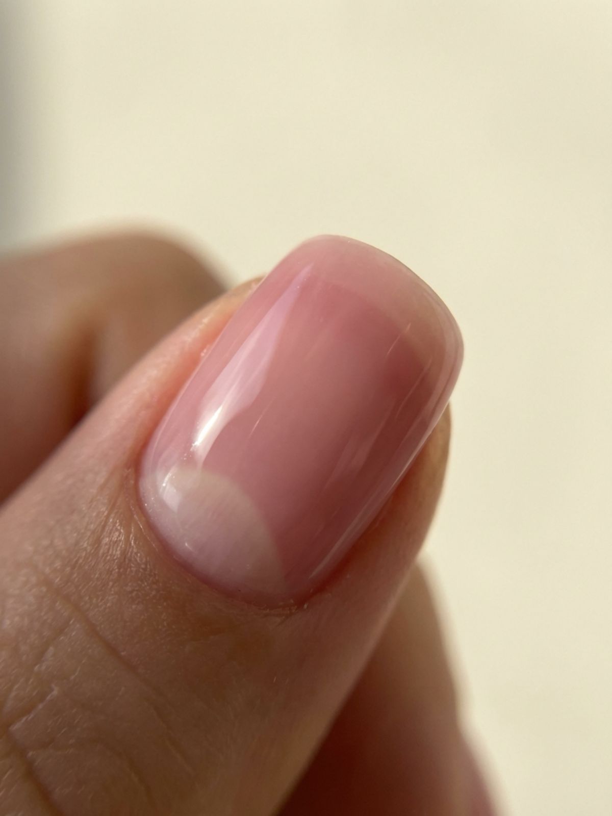 A close-up showing the sheer, jelly-like texture of soft pink minimal nails. Soft Pink Minimal Nail Ideas - A close-up showing the sheer, jelly-like texture of soft pink minimal nails.