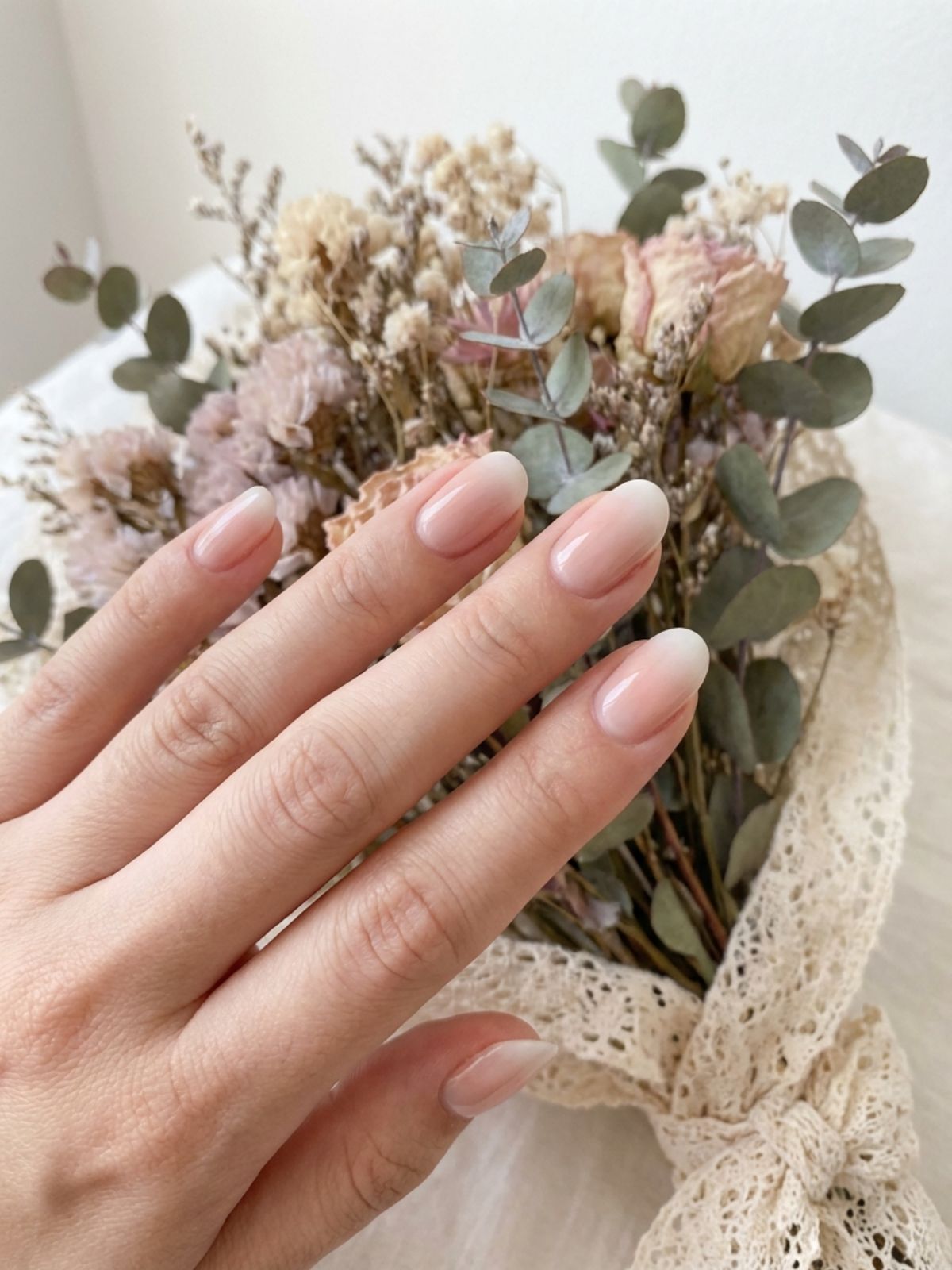 A soft gradient baby boomer manicure blending beige and milky white. Beige and Milky White Nail Ideas - A soft gradient baby boomer manicure blending beige and milky white.