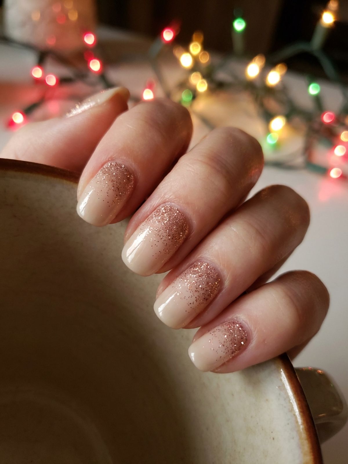 A subtle glitter fade design on a beige milky white nail base. Beige and Milky White Nail Ideas - A subtle glitter fade design on a beige milky white nail base.
