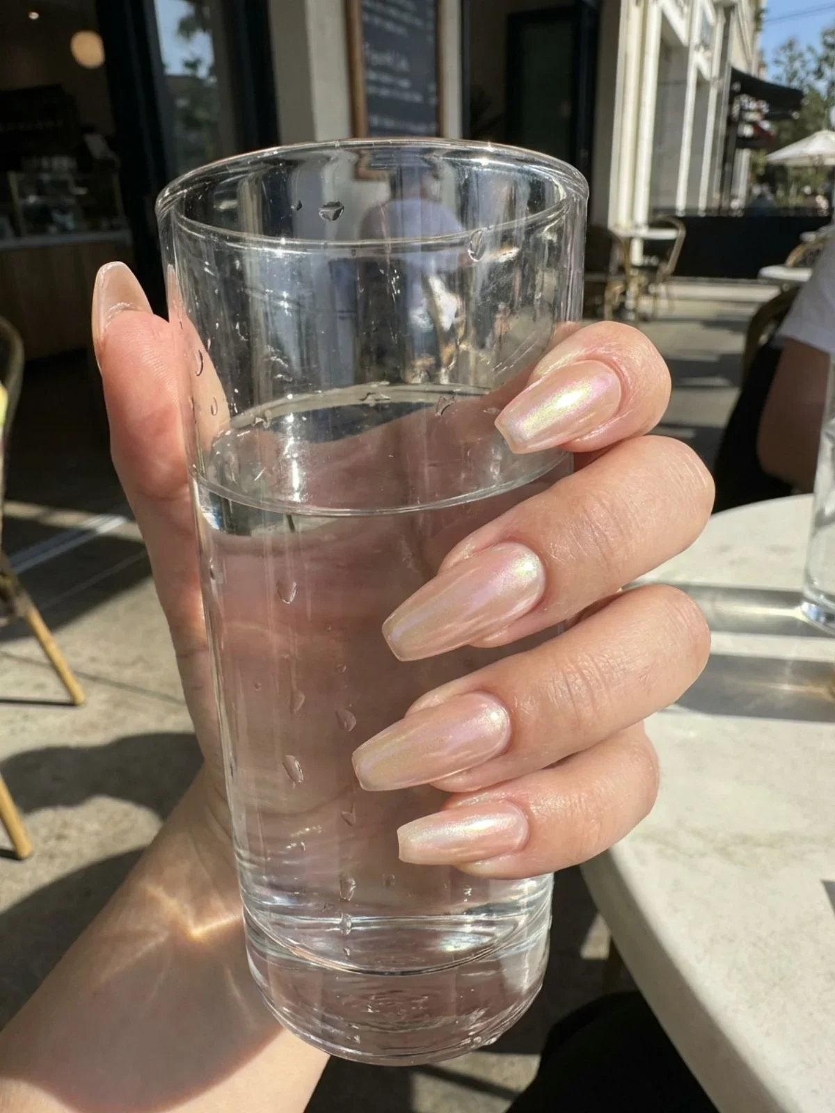 Clean Girl Nail Aesthetic Ideas - Glazed donut nails add a touch of pearl shimmer to the minimal nail palette.