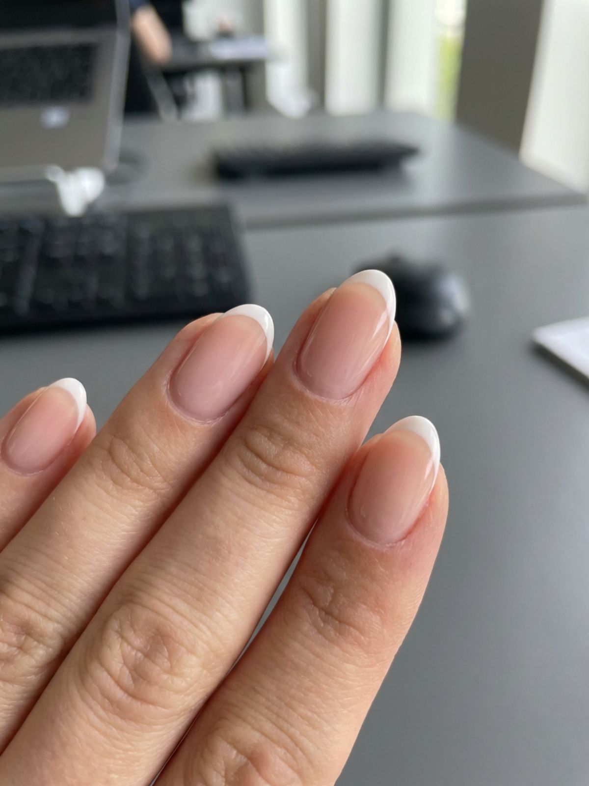 Natural Nail Designs for Work - The Micro French tip is a subtle twist on a classic, showing how natural nail designs work to keep things modern yet modest.