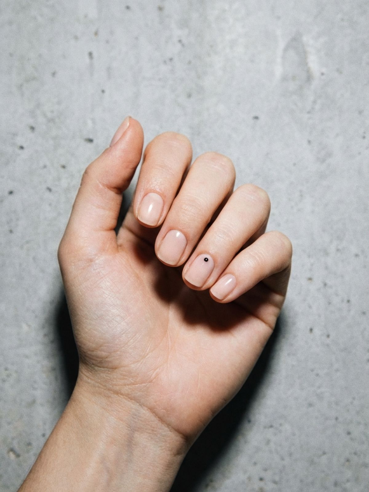 Minimal Nail Ideas for Short Nails - A single dot accent provides a modern twist to a classic nude manicure.