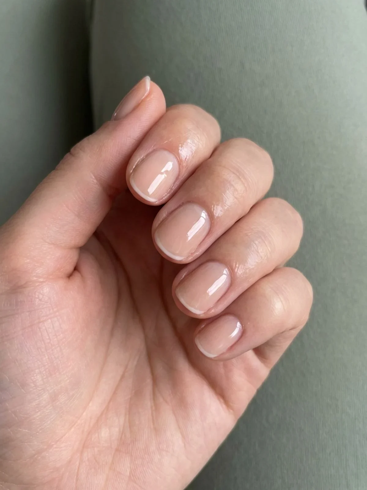 Minimal French Nails for Short Nails - Glossy minimal french nails short on a round nail shape.