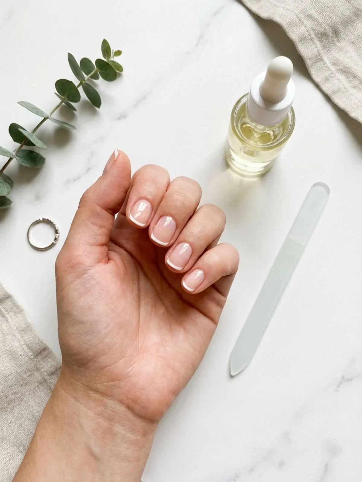 Minimal French Nails for Short Nails - Proper care and cuticle oil are essential for maintaining minimal french nails short.