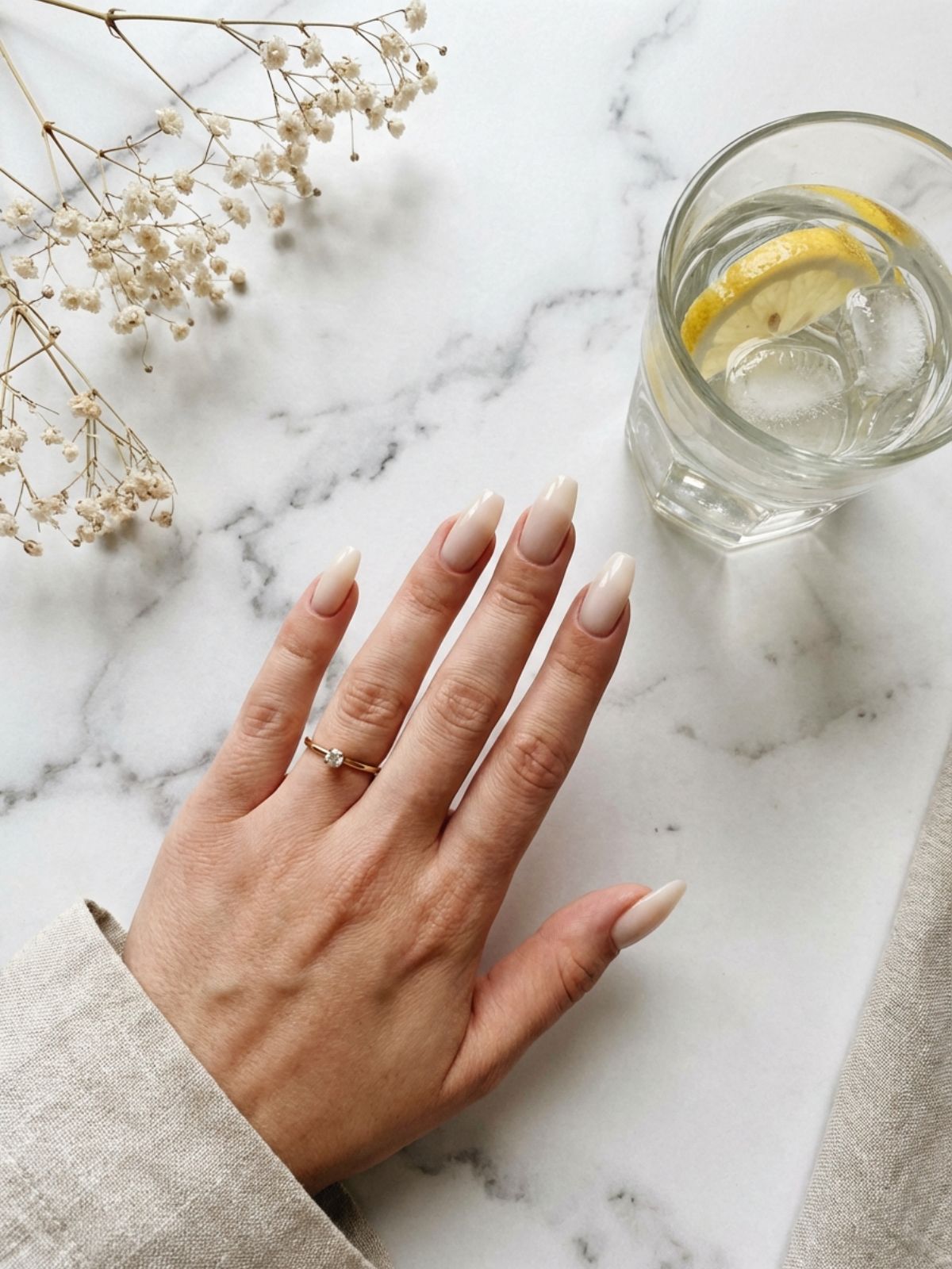 Minimalist beige milky white nails styled with gold jewelry for a clean aesthetic. Beige and Milky White Nail Ideas - Minimalist beige milky white nails styled with gold jewelry for a clean aesthetic.