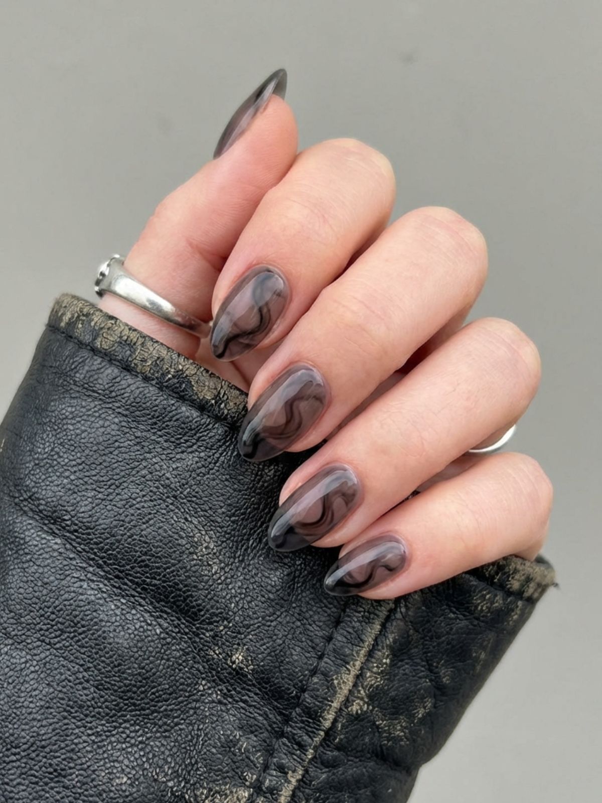 Minimal Nails That Match Any Outfit - Sheer black or 'stocking' nails add an edgy vibe while maintaining translucency.