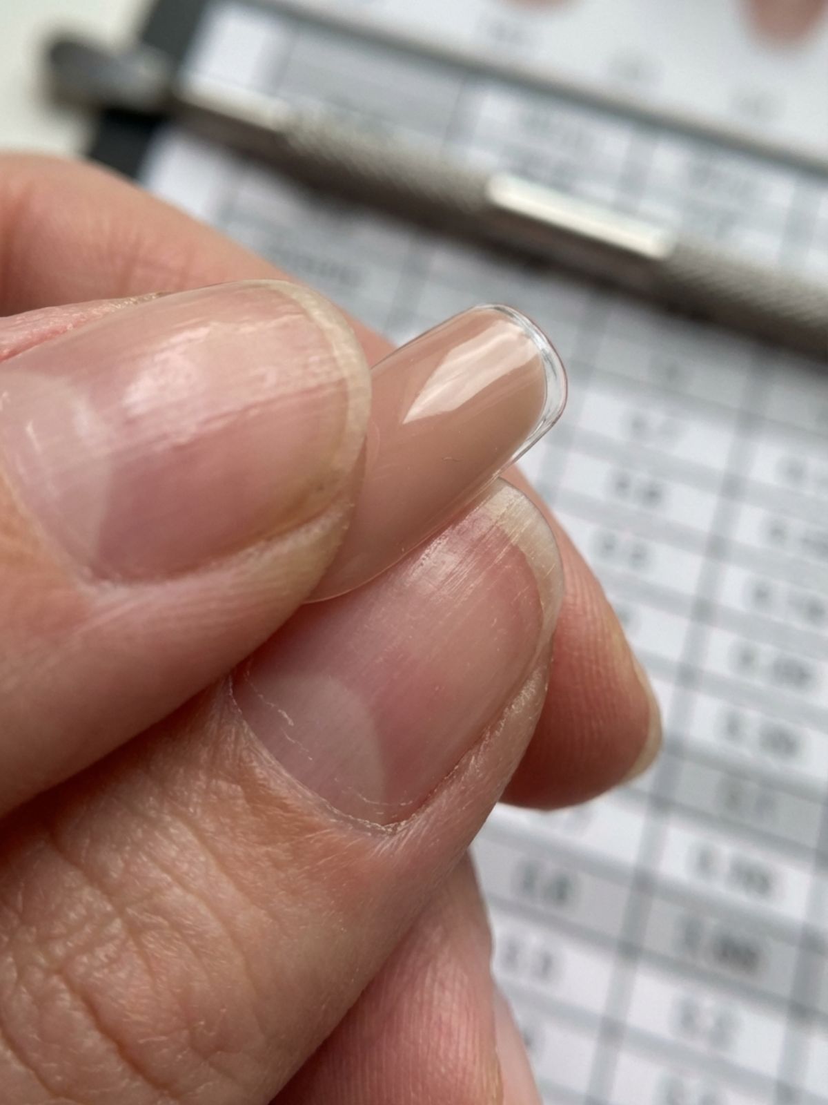 How to Apply Press-On Nails Perfectly - Correct sizing is crucial; the artificial tip should reach from sidewall to sidewall without force.