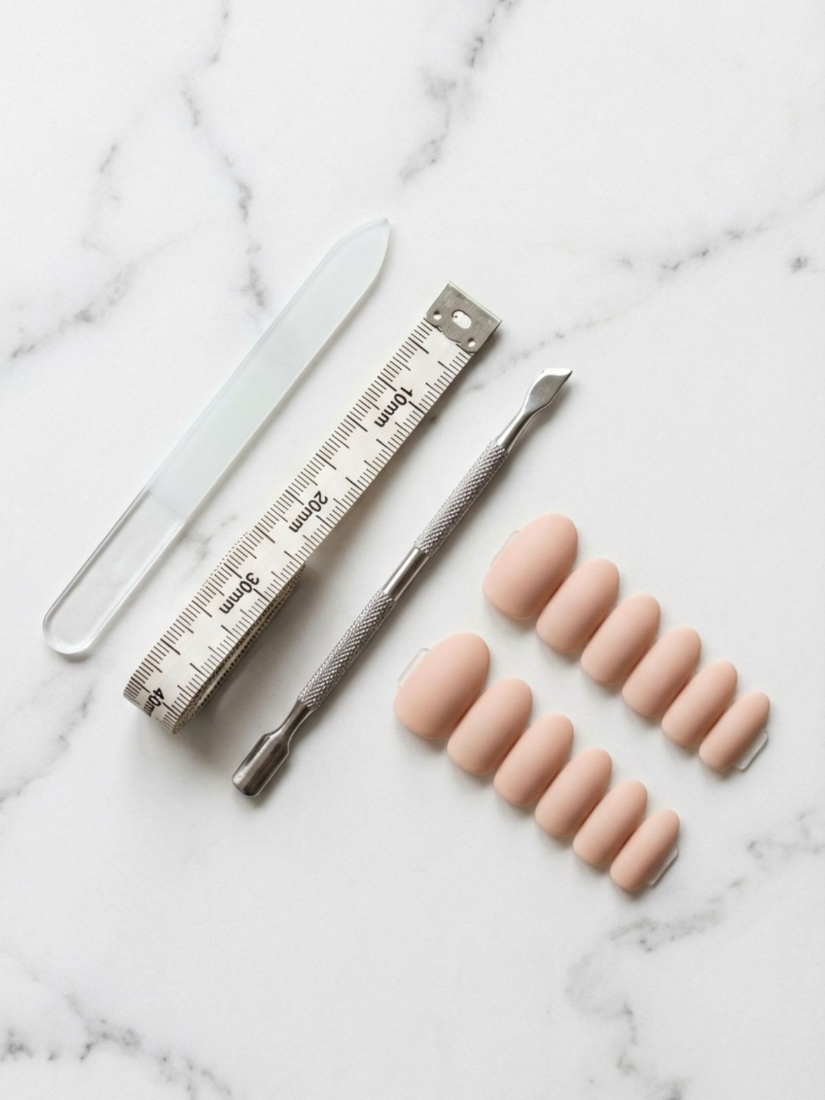 tools-measuring-press-on-nails-home How to Choose Press-On Nail Size - Precision tools like a soft tape measure are essential for finding your exact millimeter match.