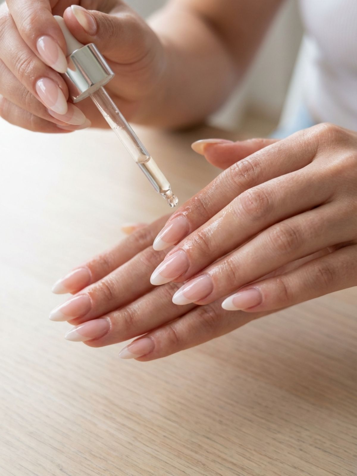 applying cuticle oil to nails Best Press-On Nails for Short Fingers - Hydrated cuticles make any press-on manicure look professional.