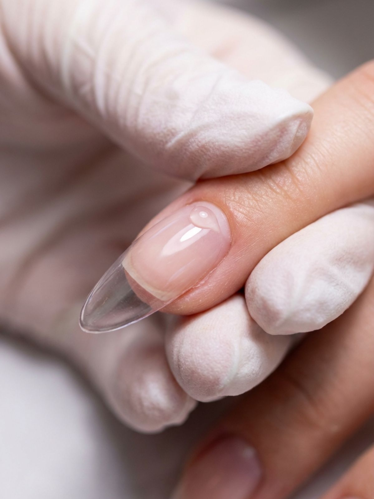 Press-On Nails Buying Guide - Apply at a 45-degree angle to push out air bubbles and create a waterproof seal.