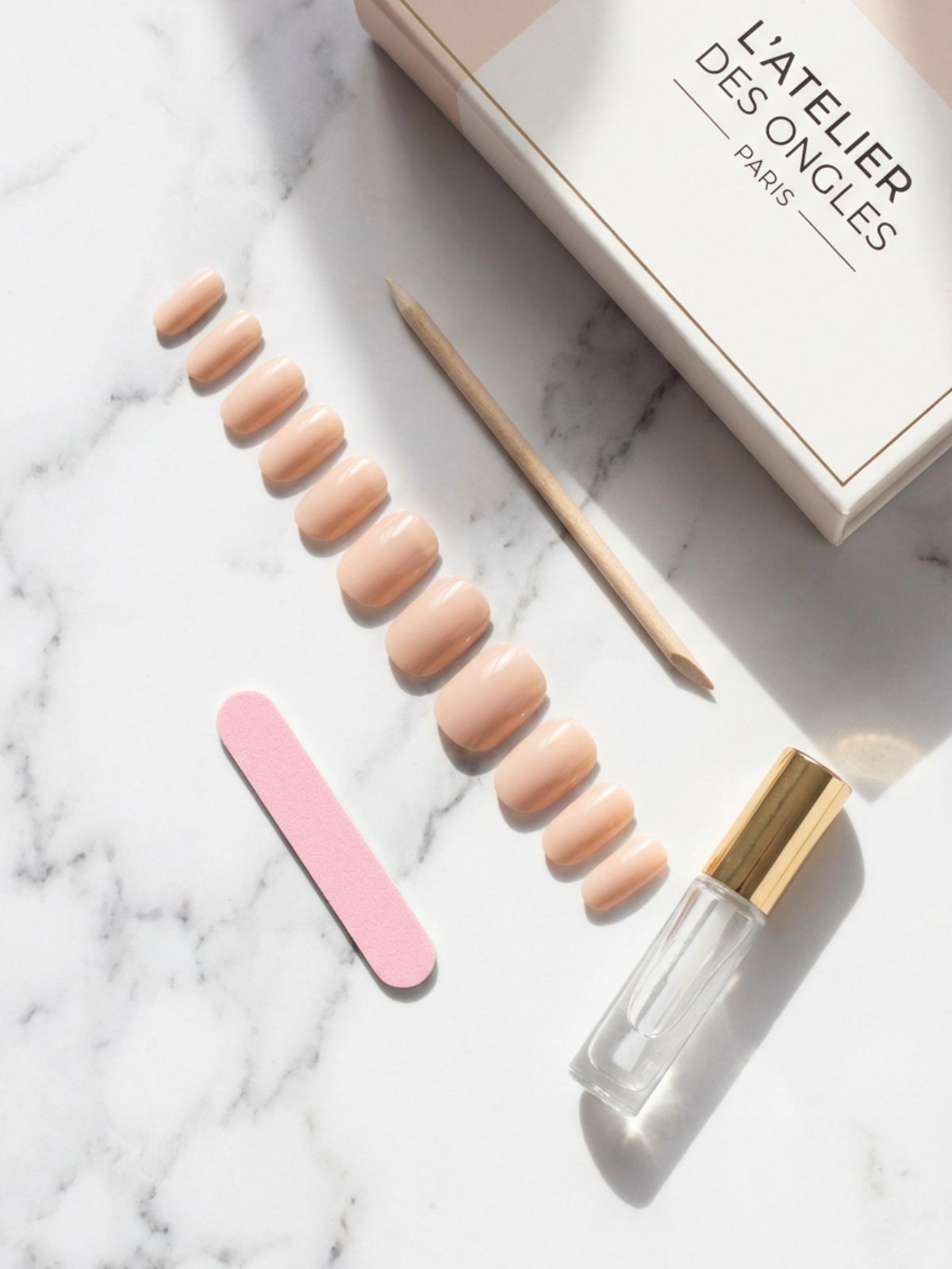 Press-On Nails Buying Guide - A complete luxury press-on kit typically includes varied sizes, a buffer, and professional-grade adhesive.