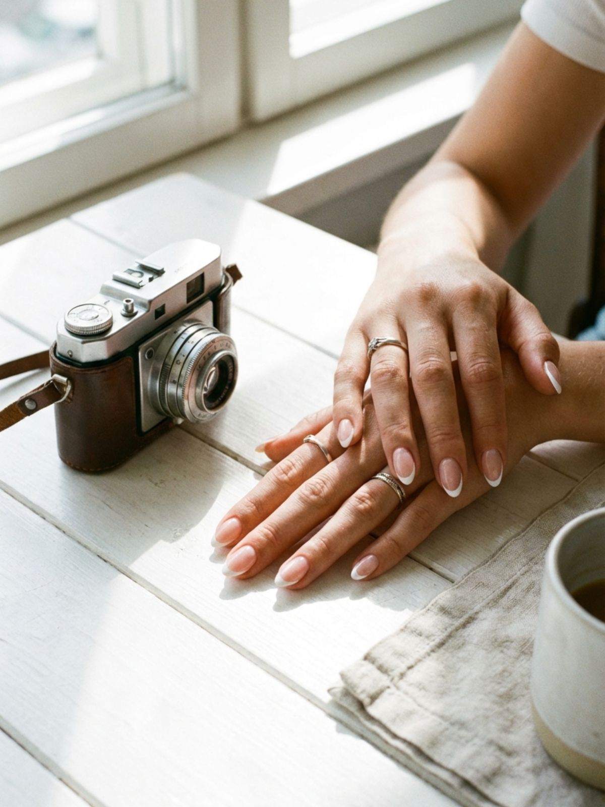 Press-On Nails for Travel and Vacation - A micro-French tip adds a touch of Parisian elegance to your vacation look.
