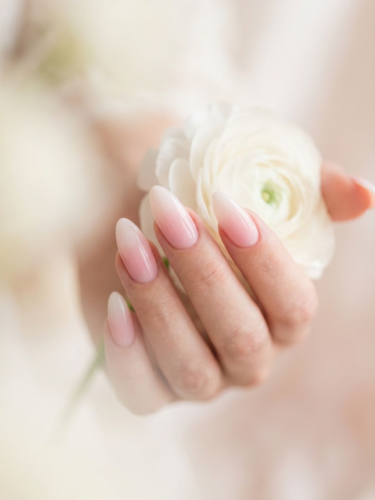 Minimal Nails for Wedding Guests - The milky ombre or 'Baby Boomer' fade creates a soft, airbrushed look perfect for romantic settings.