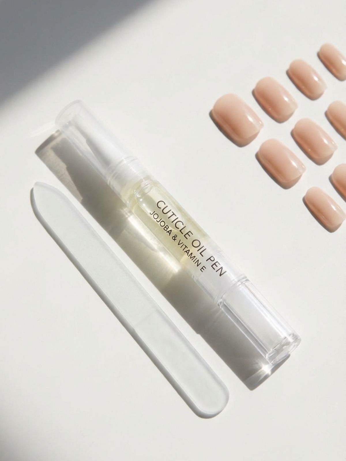Press-On Nails for Travel and Vacation - Don't forget your cuticle oil to keep your minimal manicure looking fresh after a flight.