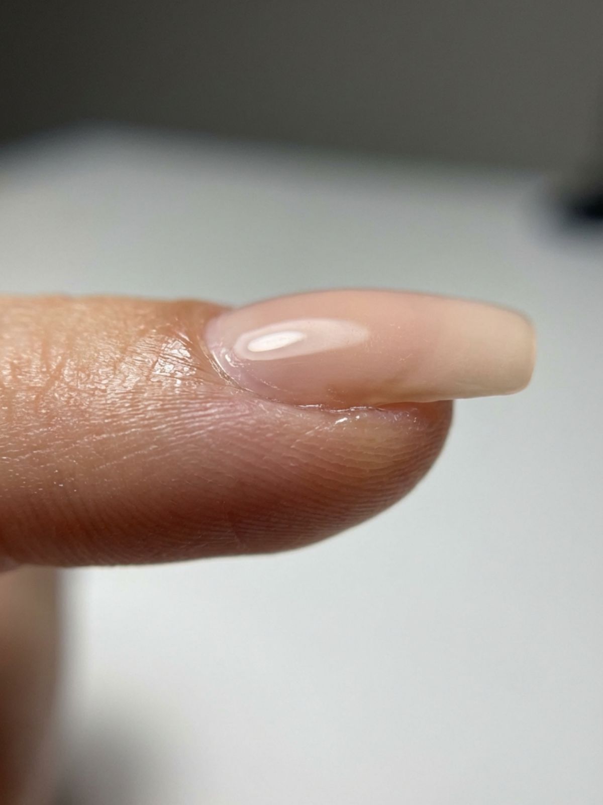 How to Choose Minimal Press-On Nail Designs - A subtle apex and thin cuticle line are the secrets to a realistic press-on application.