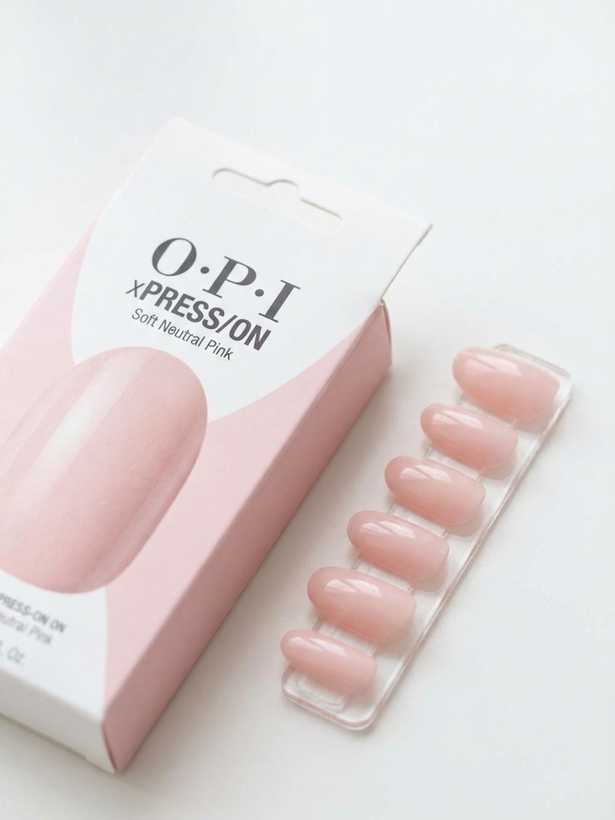 Best Minimal Press-On Nails for Spring - OPI xPRESS/ON in Somewhere Over the Rainbow Mountains is the ultimate classic neutral pink.