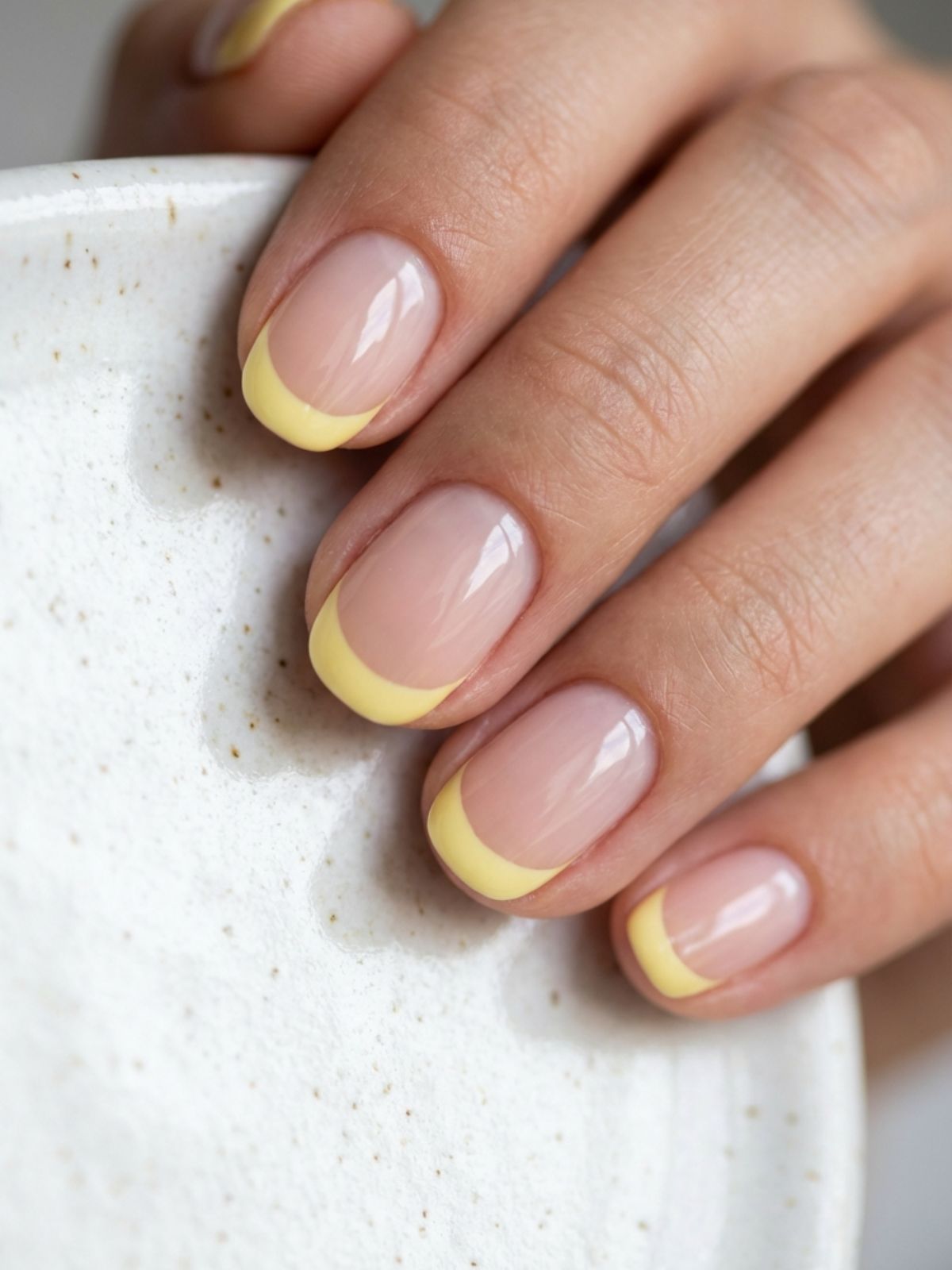 Best Minimal Press-On Nails for Summer - Soft butter-yellow tips offer a fresh, summer-ready twist on the classic French manicure.
